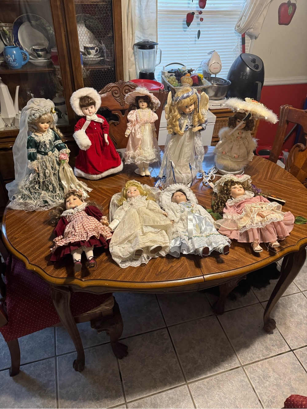 Antique porcelain dolls with multicolor vintage dresses